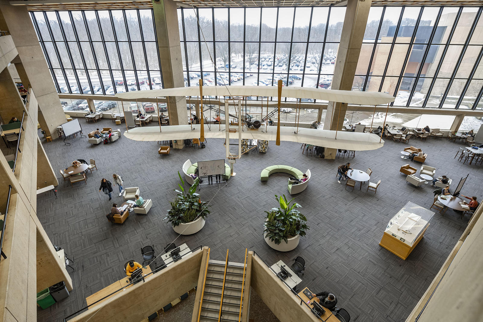 photo of the biplane, steps, tables, chairs, and windows on the second floor of the dunbar library