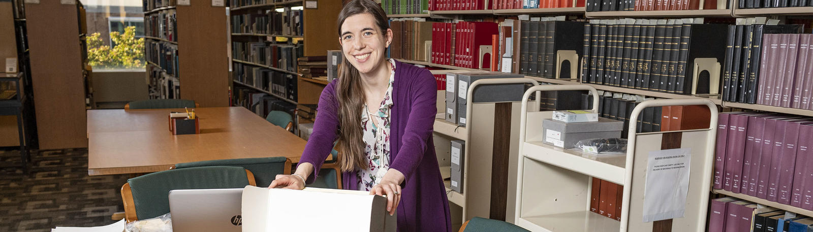 photo of a person with materials in special collections and archives