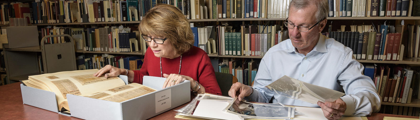 photo of two researchers in the archives