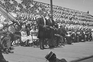 photo of the wright brothers on stage at a homecoming celebration