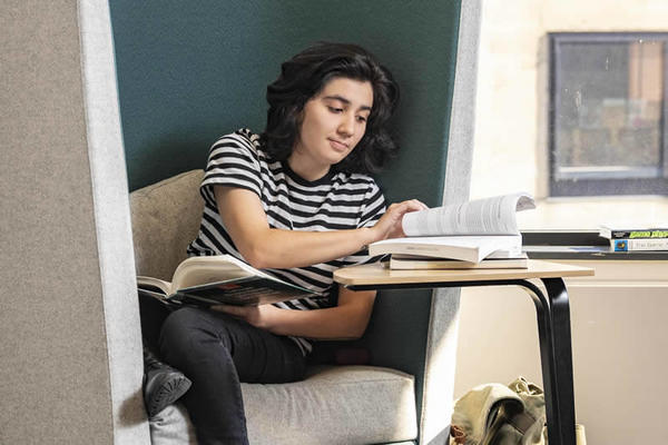 photo of a student in the library studying