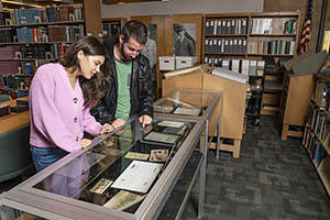 Students viewing artifacts in the University Libraries Special Collections and Archives