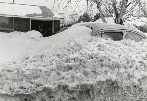 A car buried in a snow bank