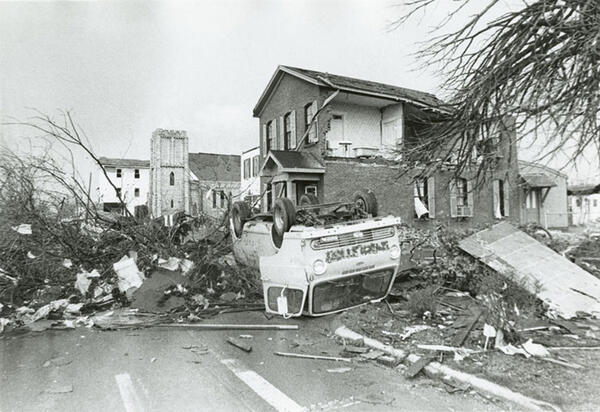 A truck upside down amid large piles of debris in the aftermath of the Xenia tornado.