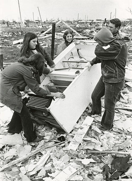 Hershey, Pennsylvania students helping clean up debris in Arrowhead in Xenia. These 5 volunteers are removing a refrigerator from a demolished home.