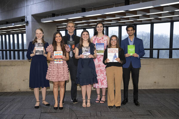 Image of 2025 Top Scholars winner holding their books