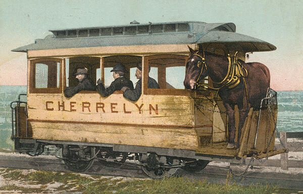 Image of a train car with a horse on board to draw the train up inclines