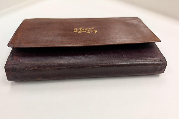 Bishop Milton Wright's 1903 Diary in closed position after conservation treatment with repairs at folds.