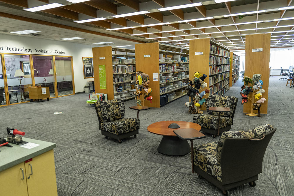 photo of chairs and bookshelves in the educational resource center in the dunbar library