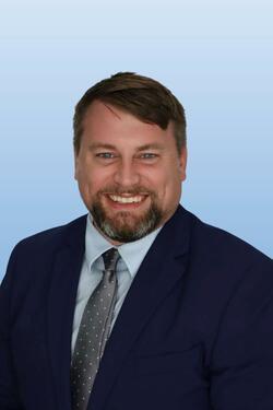Professional headshot of Zachary Adams-Willis
