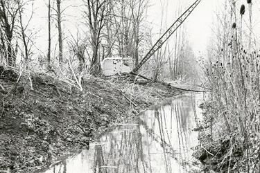 Dredge cleans and deepens old canal, 1965