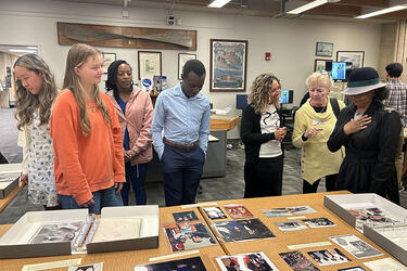 Image of members of C.J. McLin, Jr. Scholars Association viewing materials in the Archives