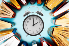 Clock surrounded by books